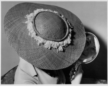 a hat (by Elsie Krassas) decorated with dried limu (seaweed) in 1935..png